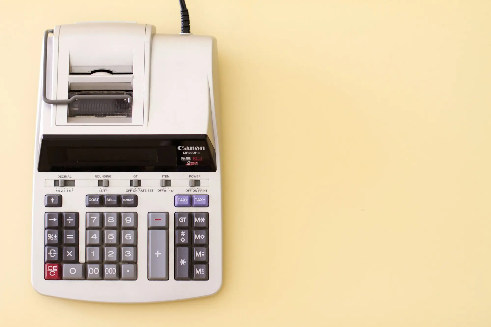 Printing calculator on a desk, ready for BAS and tax paperwork