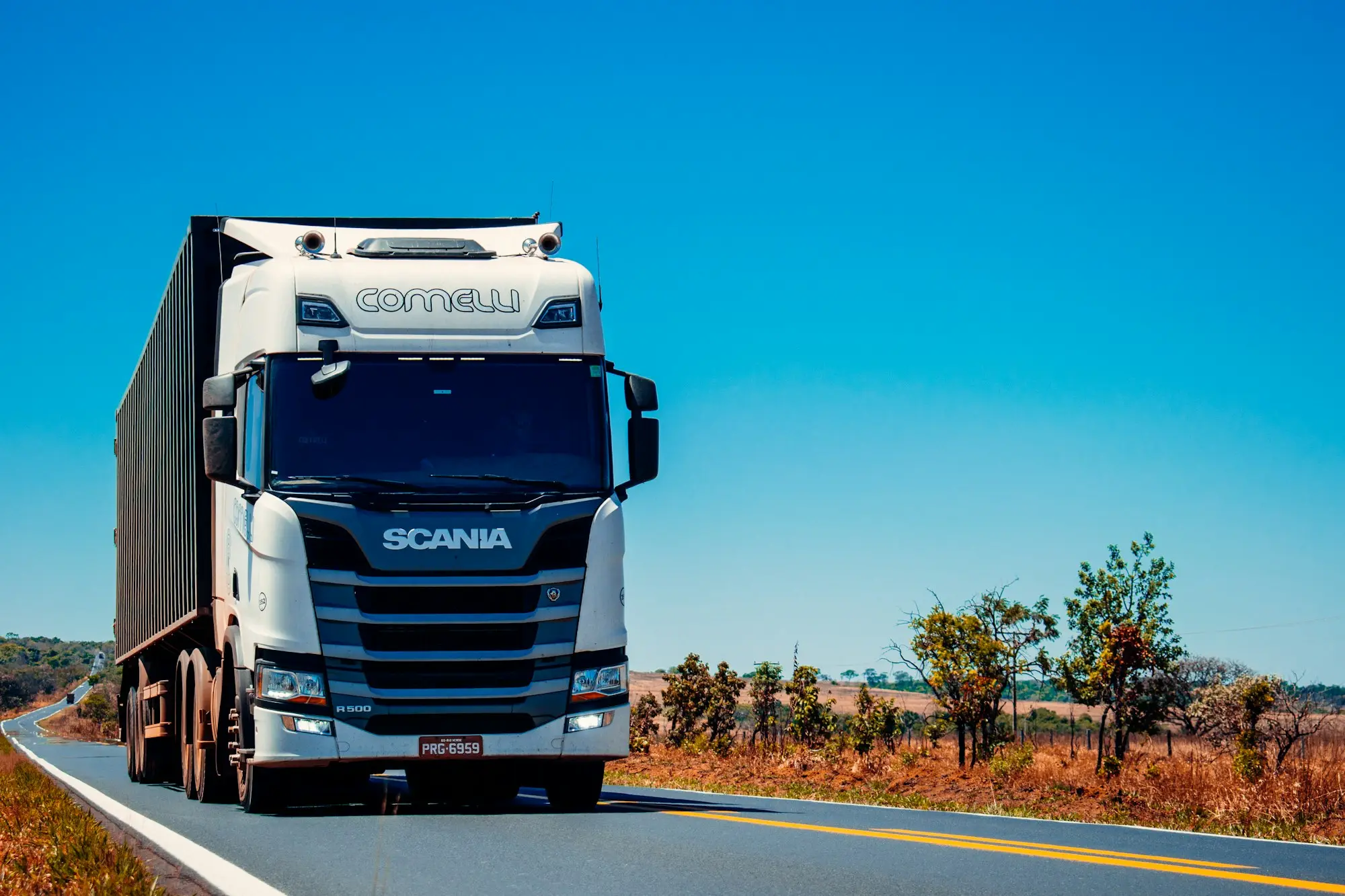 Prime mover parked on an outback road under a clear blue sky